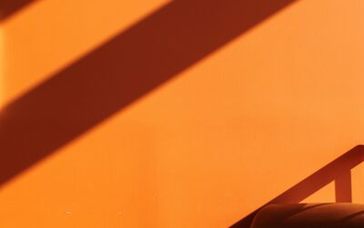 Abstract shadows on an orange wall, symbolizing the evolving landscape of LLM visibility optimization in AI search environments.